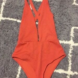 Low plunge one piece swim